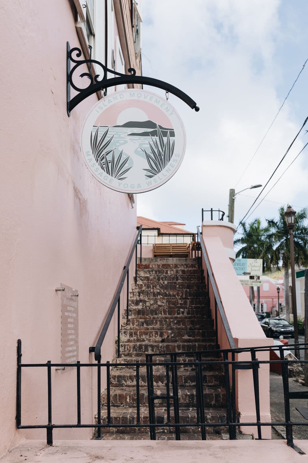 The stairs up to the spa and the Island Movement sign