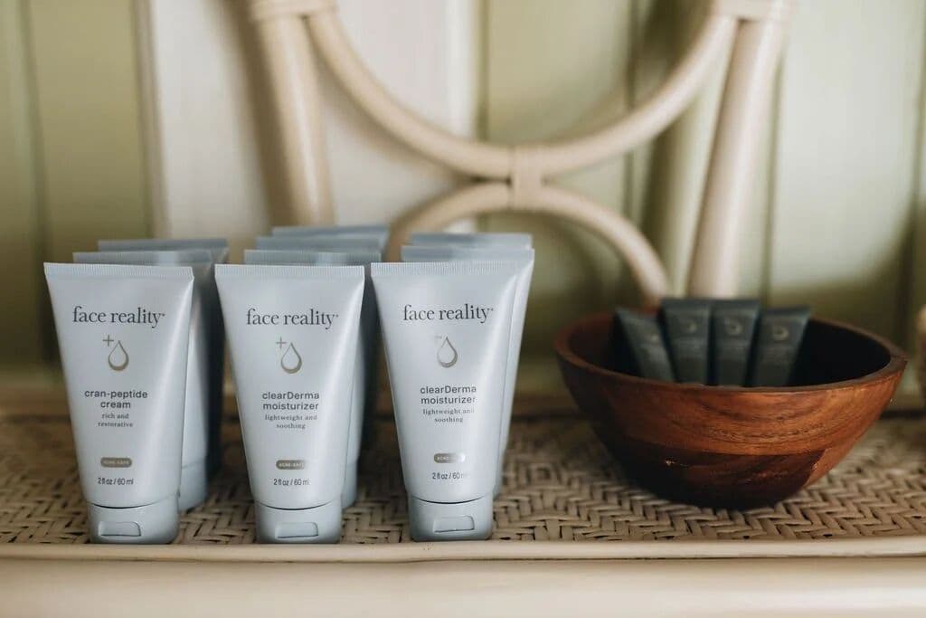 Face Reality products arranged in a wooden bowl