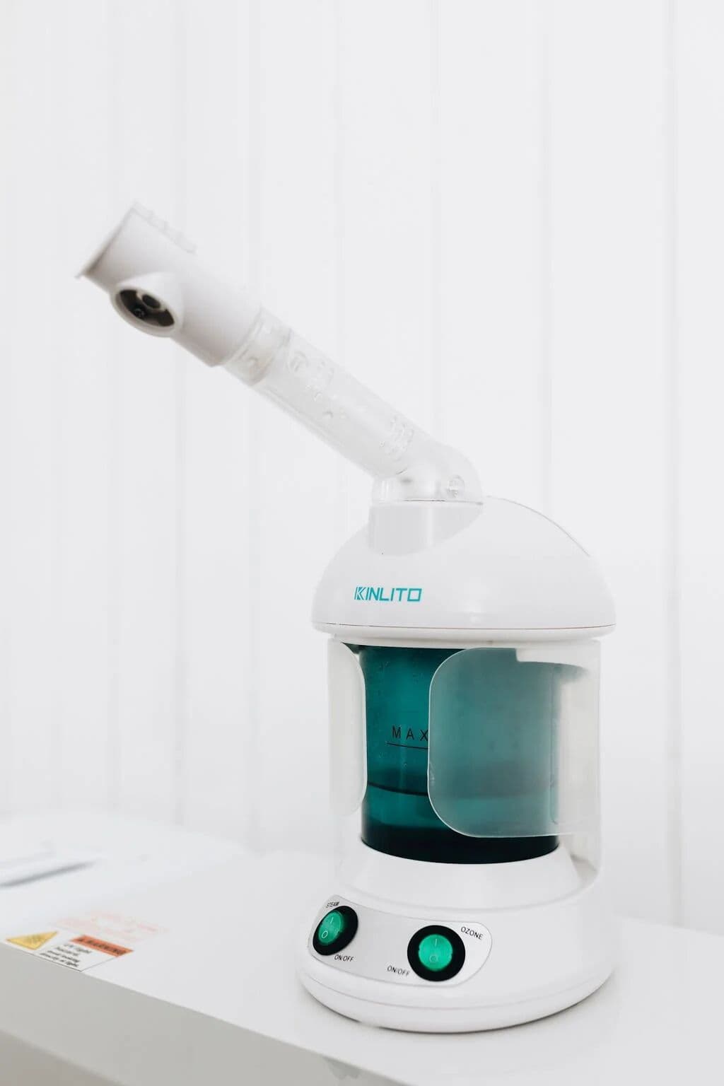 Facial steamer in a white treatment room